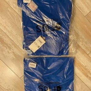 Brand new Figs scrubs top and bottom in royal blue. Never opened, tags attached